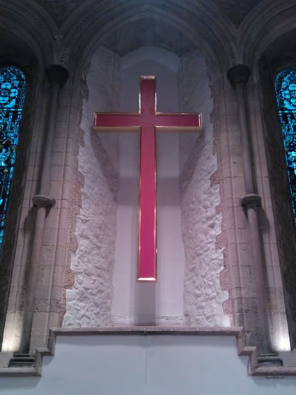 Hanging oak cross above the altar in this Grade I Listed church