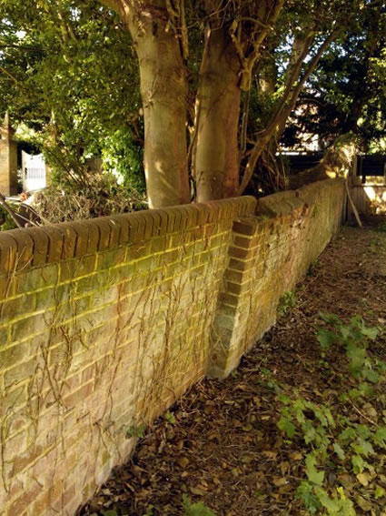 St. Clements Church boundary wall before rebuilding and tree removal