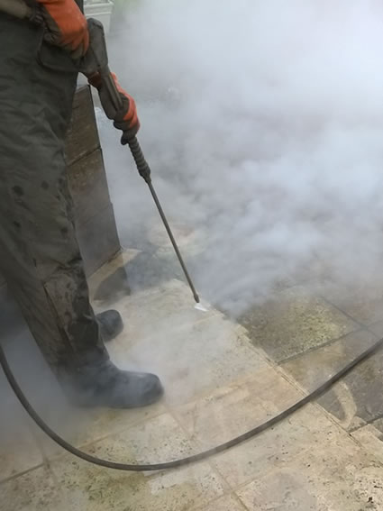 Stone paving being cleaned using the DOFF steam system